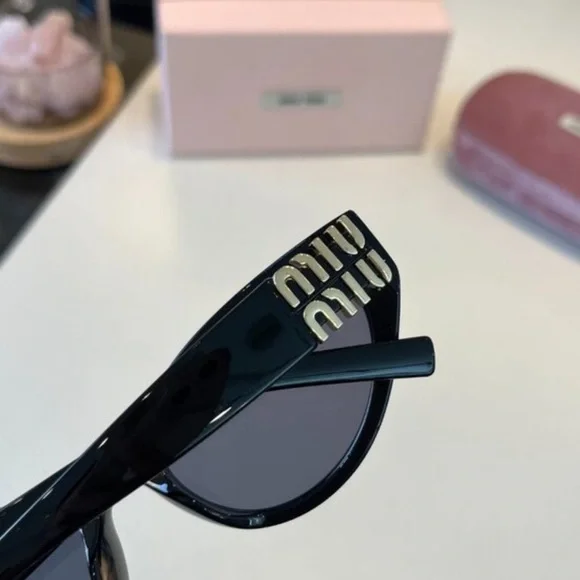 Miu Miu Black Cat-Eye Sunglasses with Gold Temple Detail - Picture 4 of 5